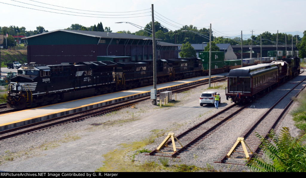 NS 3609 leads train 25A past the NS research and test train parked for the weekend